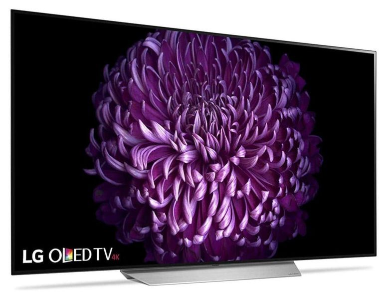 The lg oled tv features a vibrant purple flower embellishment.