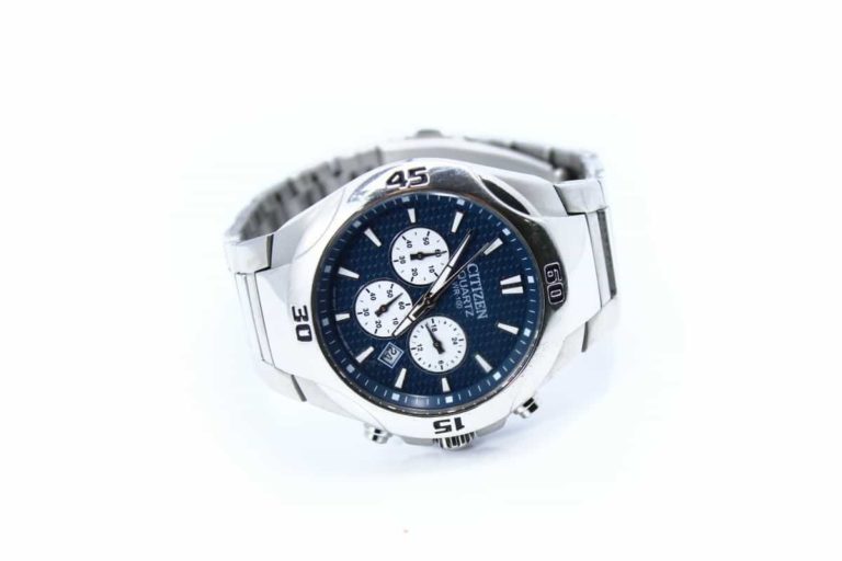 A silver watch with blue dials on a white background available for sale through Amazon's Seller Central management.
